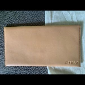 Tan leather envelope clutch from Nisolo